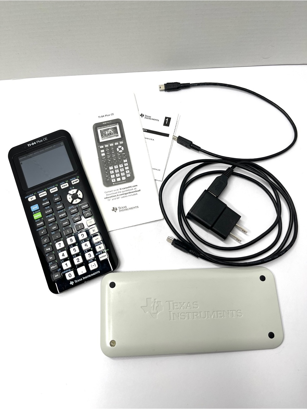 Texas Instruments TI-84 Plus CE Graphing Calculator - Black with White Cover